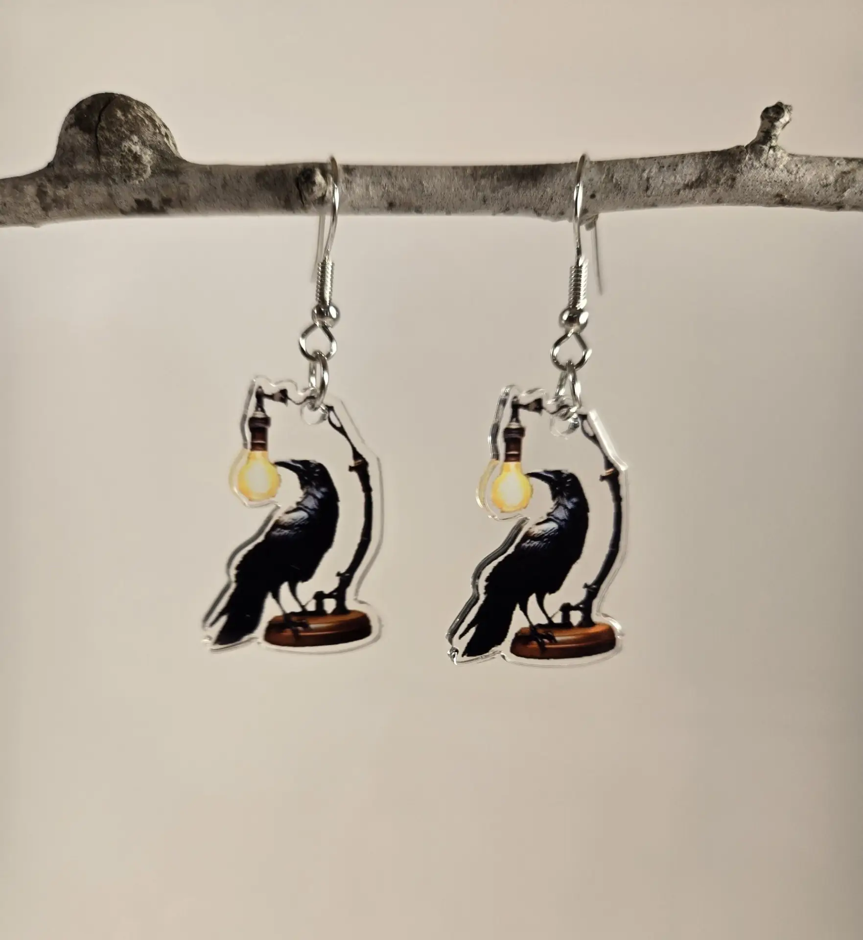 raven with lamp earrings